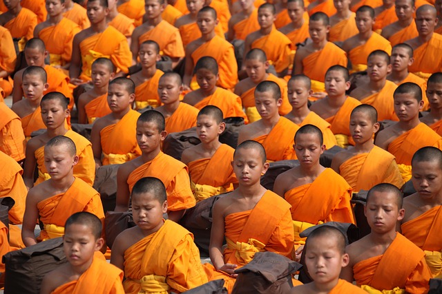 Person meditating peacefully at sunrise, illustrating mental well-being benefits