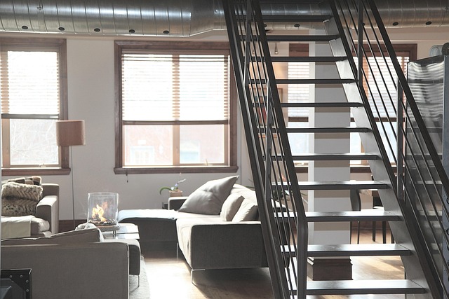 A serene minimalist living room with ample open space and carefully placed furniture